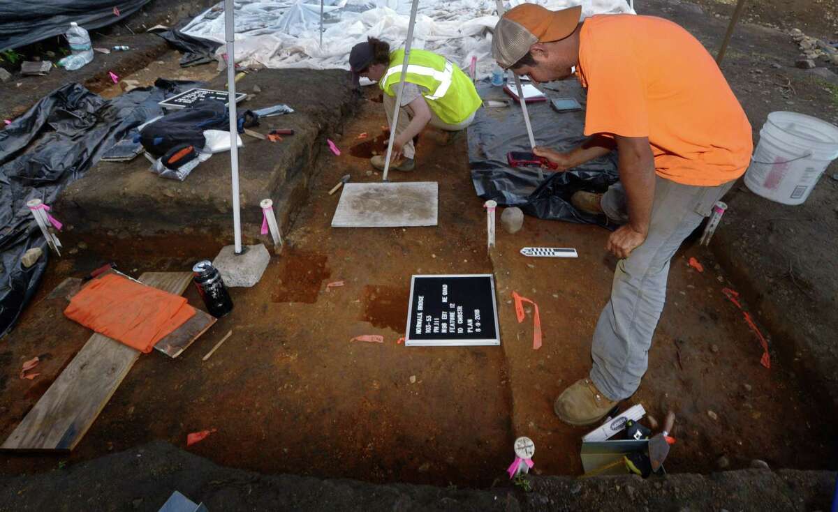 Archeologists with Archeological and Historical Services including Dan Zoto and Megan Willison work diligently following the Connecticut Department of Transportation press conference on the archeological dig Thursday, August 9, 2018, at the Walk Bridge construction site in Norwalk, Conn. The dig uncovered rare Native American artifacts including some that date back thousands of years.