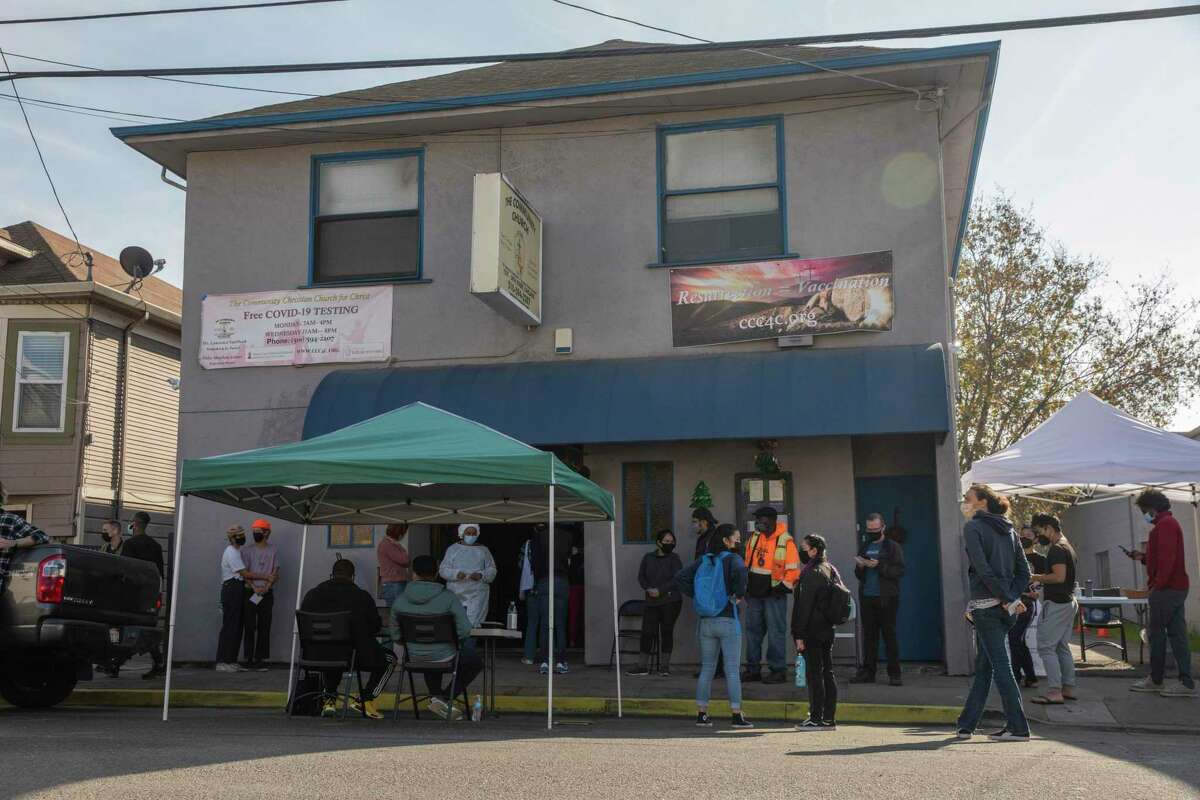 People make line to receive the COVID-19 vaccine at the Community Church on Thursday in Oakland, Calif. The church, at 1527 34th St., offers walk-in appointments for the COVID-19 vaccine.