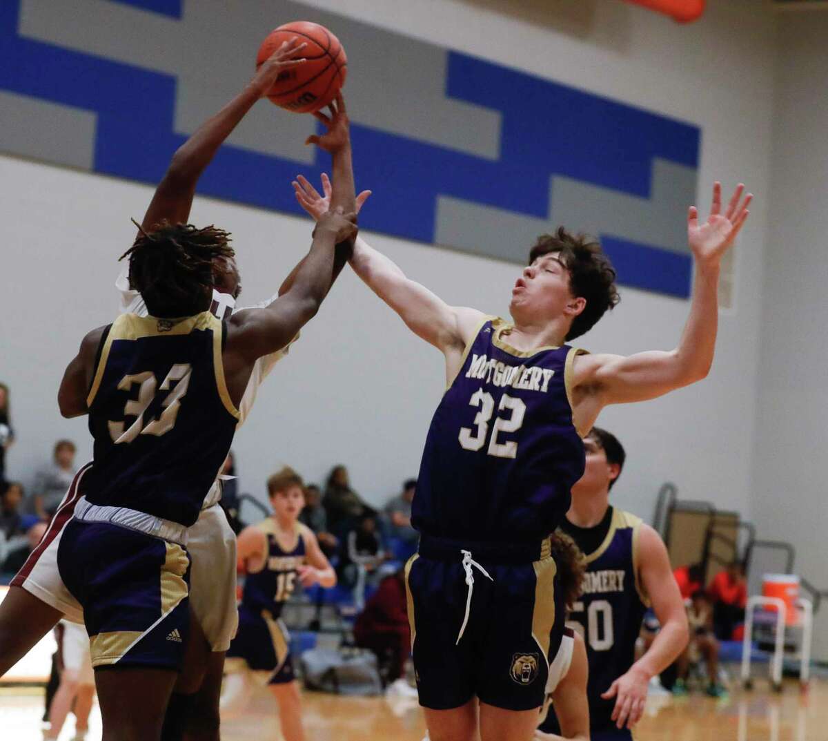 Montgomery small forward Blake Haneline (32) fights for a rebound during a game at the Beast Up Invitational at Grand Oaks High School, Thursday, Dec. 2 2021, in Spring.