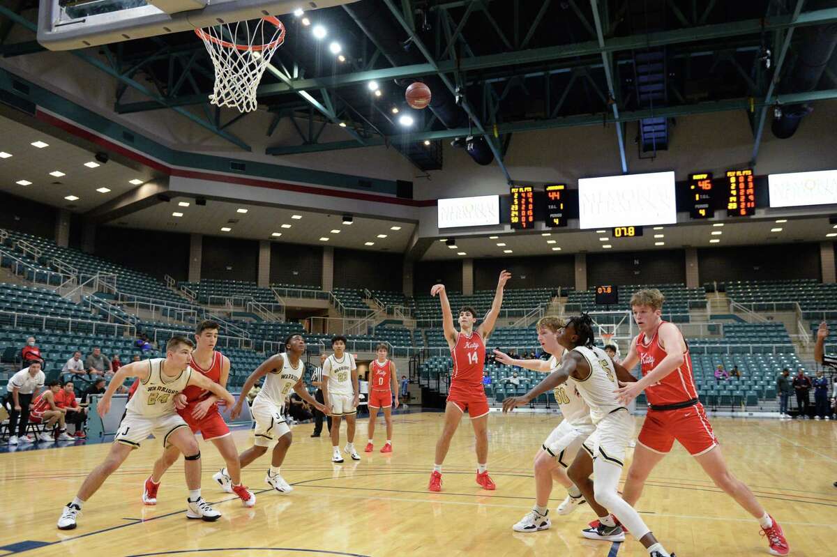 Aydan Perdue (14) of Katy attempts a free-throw in the second half of a pool game between the Katy Tigers and the Jordan Warriors during the Katy ISD Basketball Classic on Thursday, December 2, 2021 at the Leonard Merrill Center, Katy, TX.