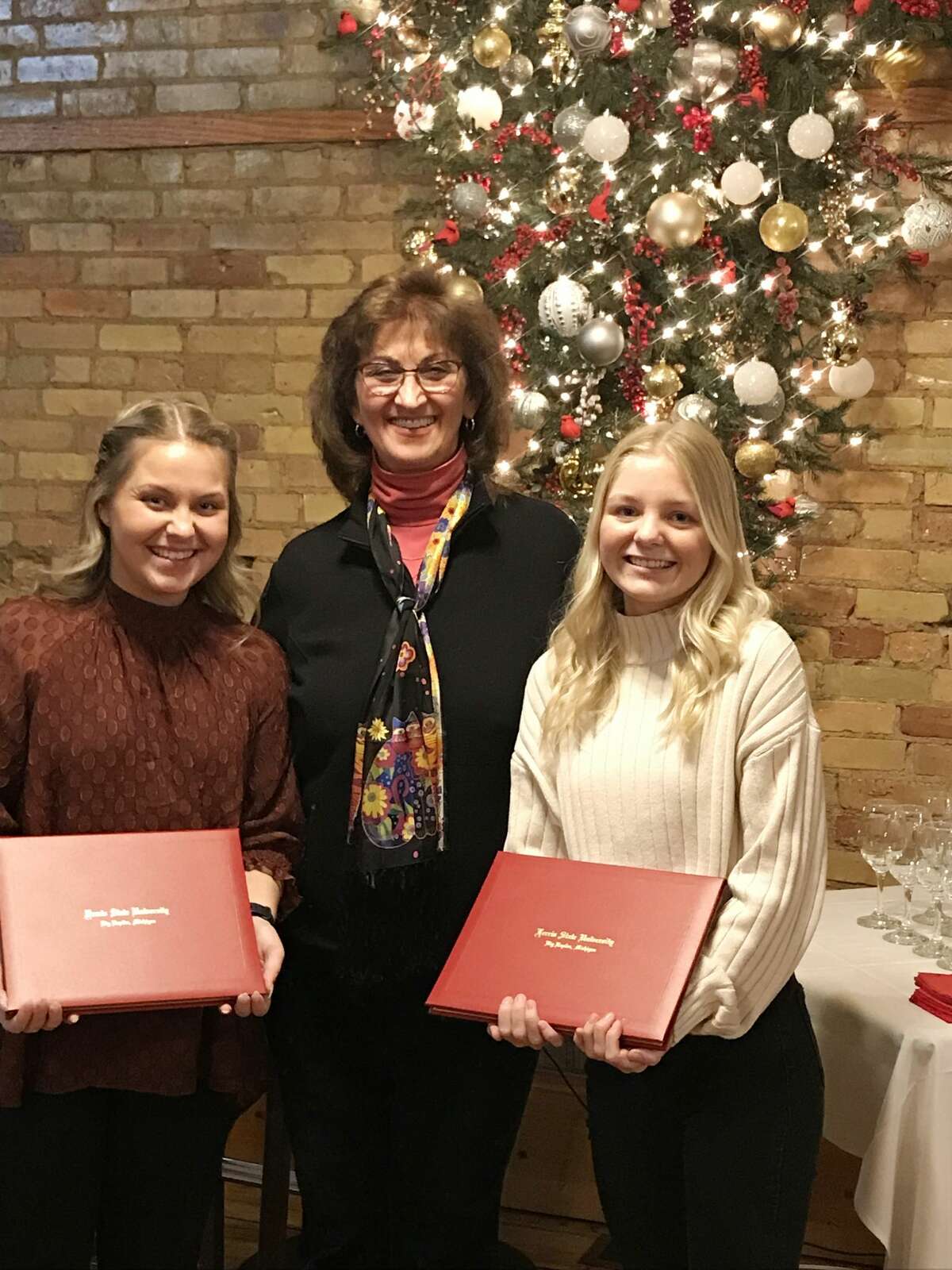 Pictured, the from the left, is Breanna Green, award recipient; Jennifer Cochran, president of AAUW-Big Rapids; and Brooke Jacobs, award recipient.