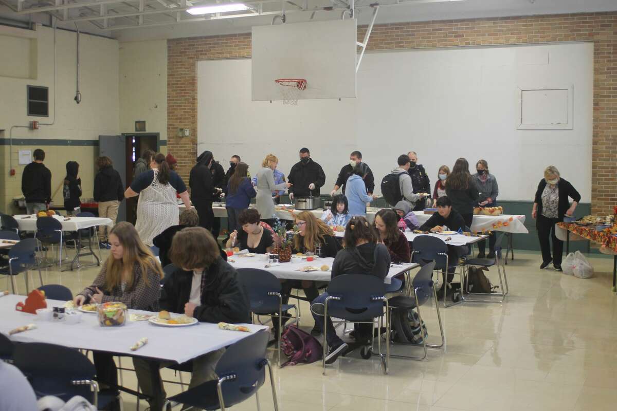 CASMAN Academy students enjoy their Thanksgiving meal at the school on Thursday.