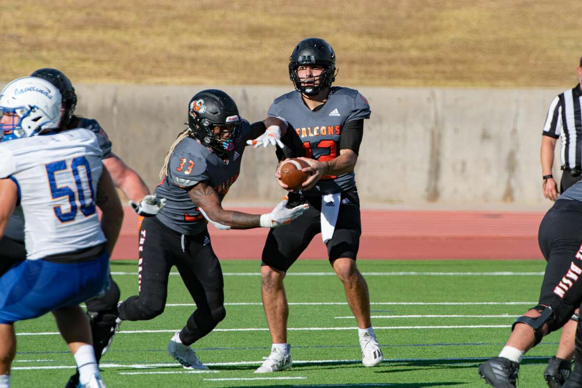 UTPB's Suddin Sapien (12) hands off the ball to Nathan Tilford during a game against Texas A&M-Kingsville this season.