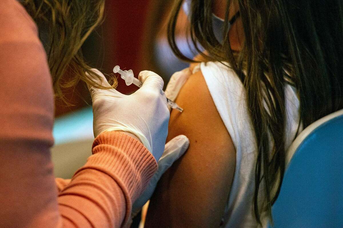 A 5-year-old child receives the Pfizer-BioNTech COVID-19 Vaccine for 5-11 year old kids at Hartford Hospital in Hartford, Connecticut, on Nov. 2, 2021.