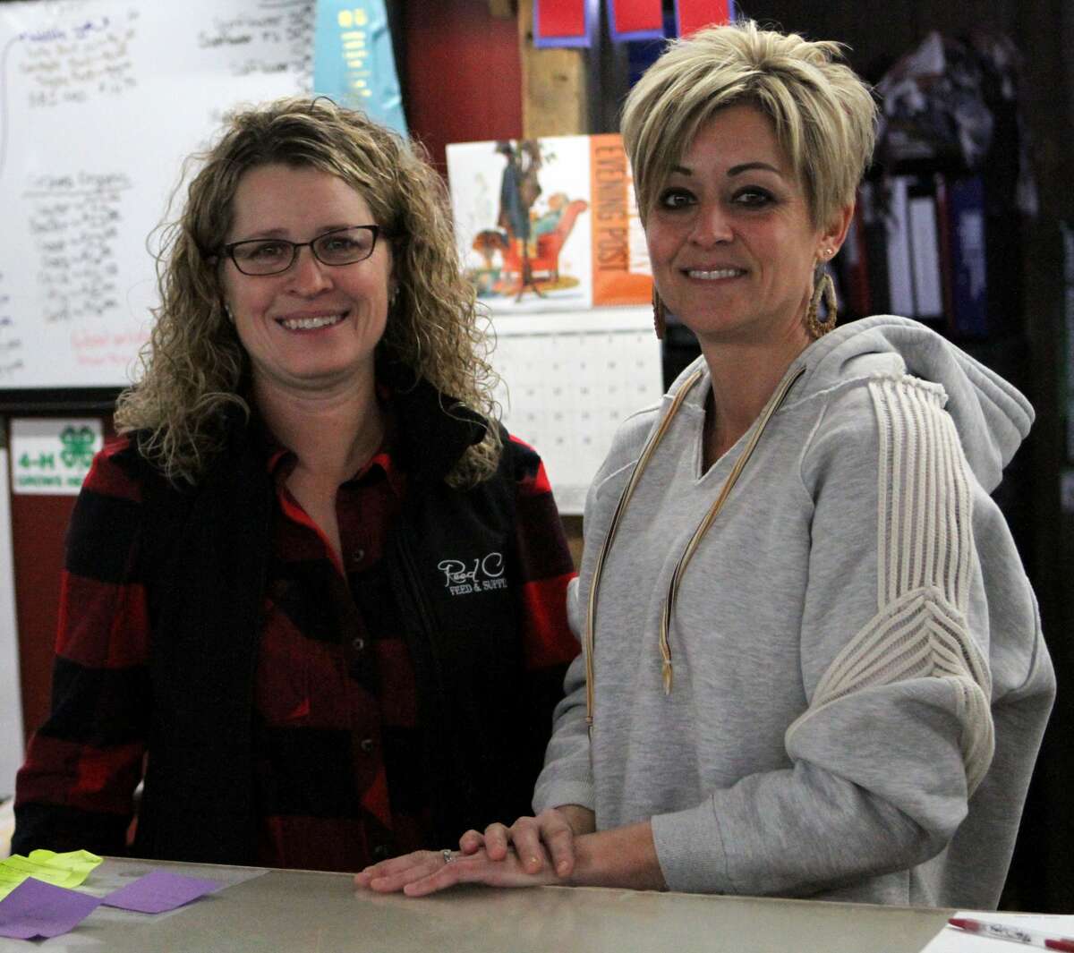 From left-to-right: Reed City Feed & Supply owners Michelle Nicklas and Jill Terryn stand behind the front counter of their family owned establishment.