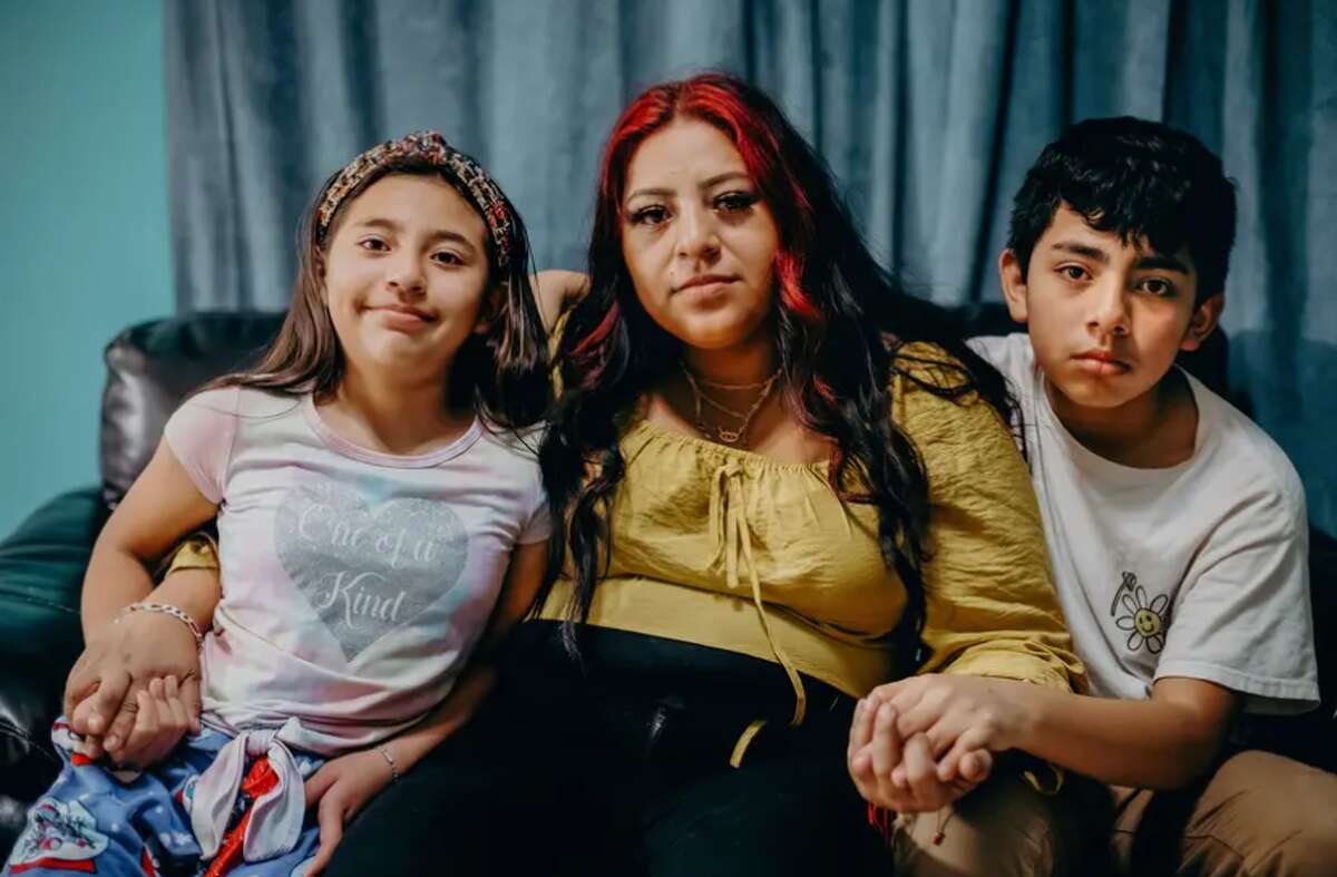 Guadalupe Martinez, 33, and her children Kevin, 13, and Ashley, 9, at their home in San Antonio. Guadalupe's husband, Juan Reyna, has been held in an immigration detention center for 11 months. 