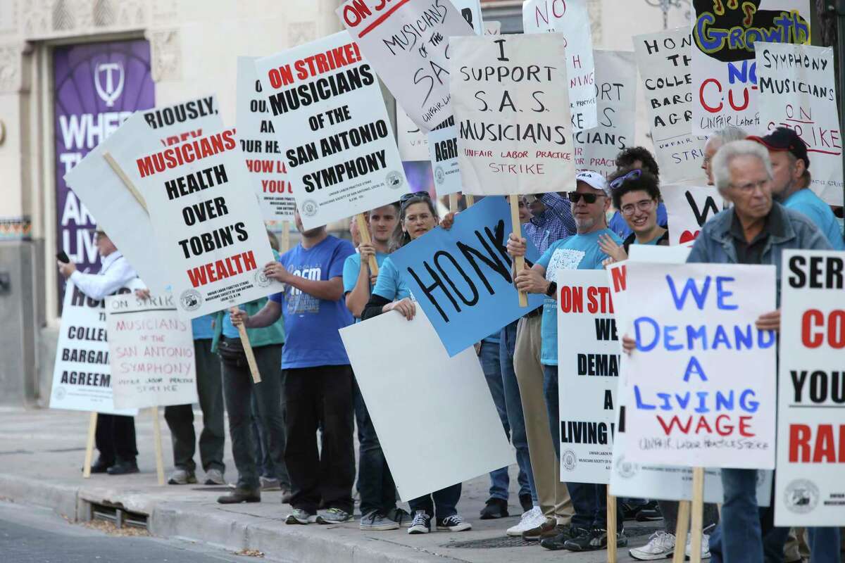 Members of the San Antonio Symphony strike by the Tobin Center for the Performing Arts, on Nov. 22.