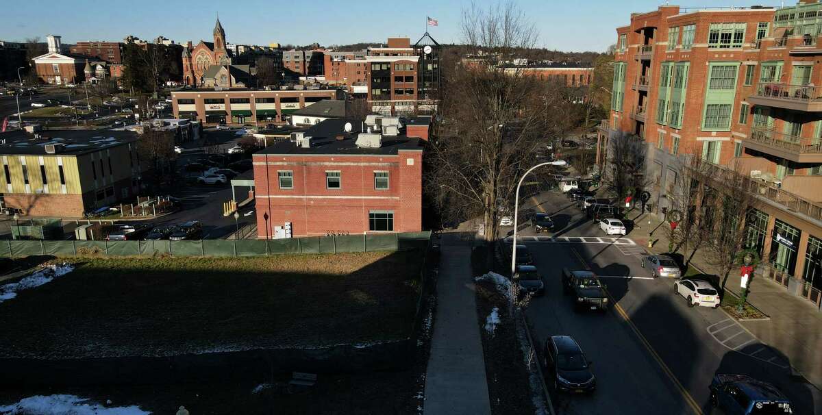 The vacant lot at 269 Broadway, left, where a six story apartment complex is being proposed on Friday, Dec. 3, 2021, in Saratoga Springs, N.Y. Residents, historic preservationists are in opposition of its construction in the historic district.