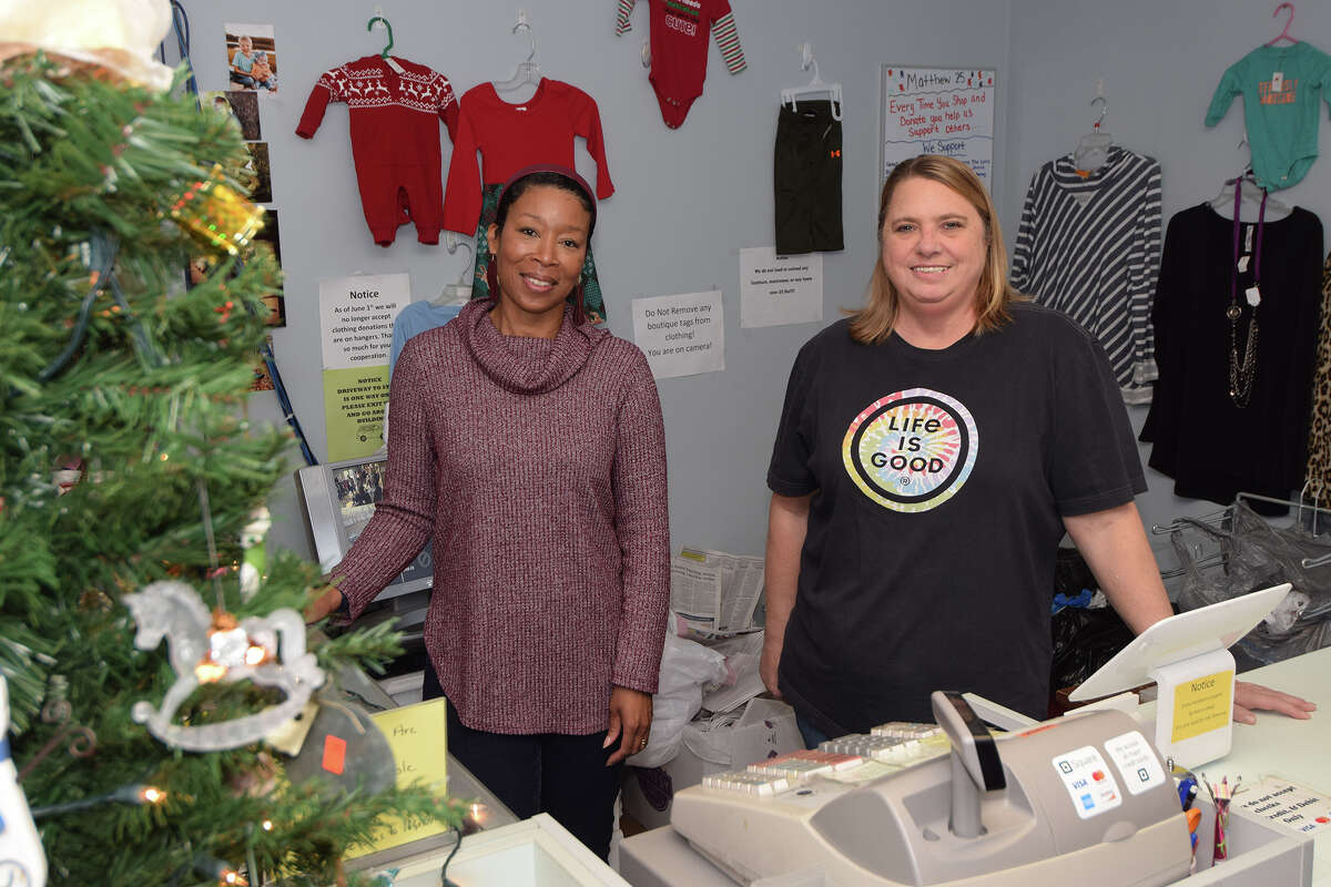 Employee Krystal Sweatman (left) and manager Mandy Hutton wait to help Christmas shoppers at  Matthew 25 Thrift Shop. 