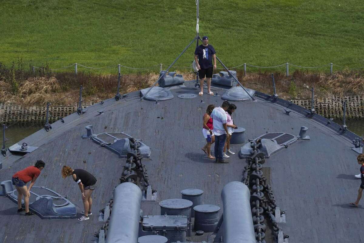 People explore the deck of Battleship Texas on Sunday, Aug. 11, 2019, in Houston.