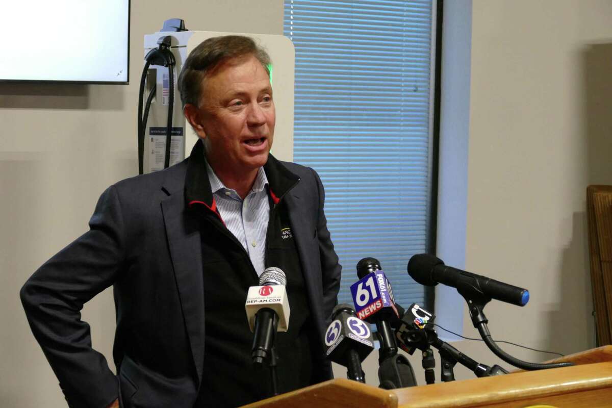 Gov. Ned Lamont speaks to reporters in Oxford, Conn. on Friday, Dec. 3, 2021.
