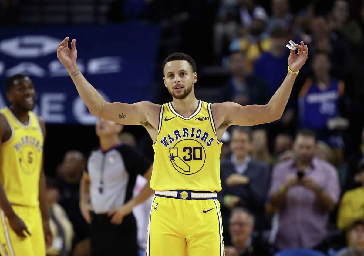 OAKLAND, CA - OCTOBER 24: Stephen Curry #30 of the Golden State Warriors reacts to the crowd chanting "MVP" during their game against the Washington Wizards at ORACLE Arena on October 24, 2018 in Oakland, California. Curry finished the game with 51 points. NOTE TO USER: User expressly acknowledges and agrees that, by downloading and or using this photograph, User is consenting to the terms and conditions of the Getty Images License Agreement. (Photo by Ezra Shaw/Getty Images)