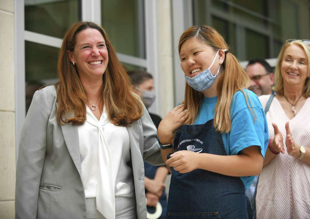 Abilis CEO Amy Montimurro, left, in July 2021 alongside Michelle Yoon of The Cafe at Greenwich Library. As part of a hiring drive to add more people to help in job coaching and other services offered by the nonprofit, Abilis is running job fairs and affixing vehicles with magnetic placards advertising open jobs.