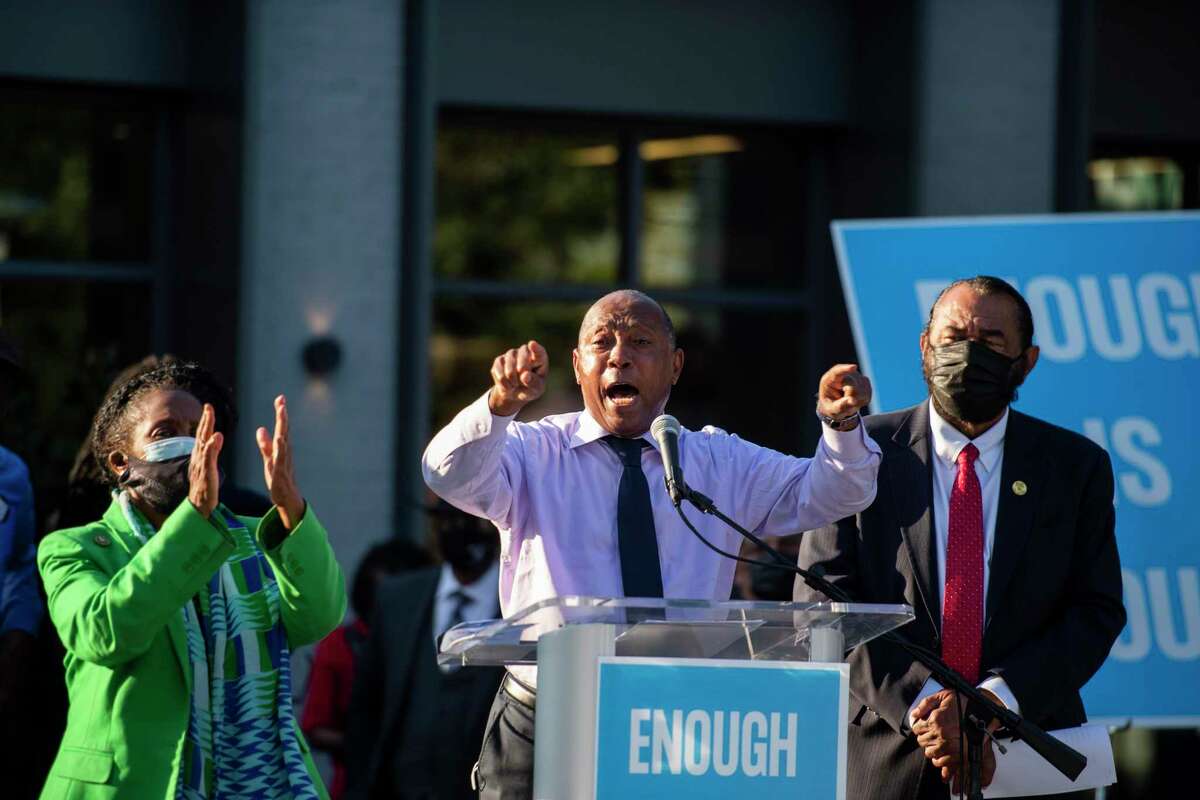 Mayor Sylvester Turner speaks to the audience with Rep. Sheila Jackson Lee and Rep. Al Green on stage during a rally against the redistricting efforts in Austin on Thursday, Oct. 7, 2021, at Emancipation Park in Houston, Texas.