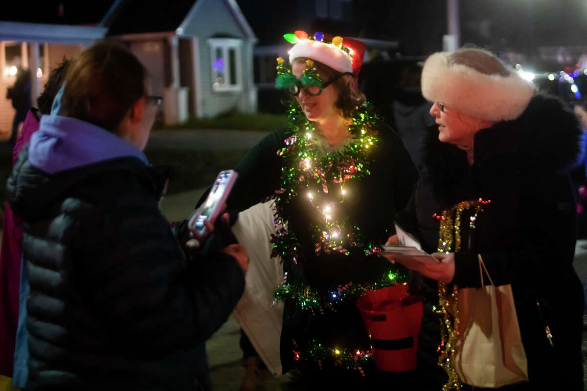 Hundreds of people flock to downtown Sanford for the Sanford Shines celebration and parade Friday, Dec. 3, 2021.