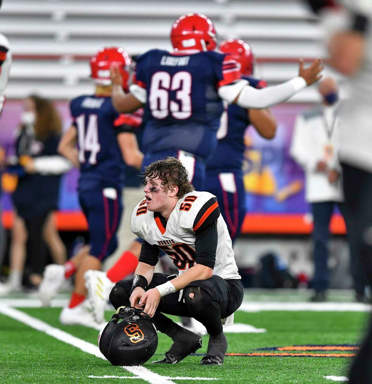 Schuylerville's Carson Patrick reacts at the final whistle of a loss against Chenango Forks in the NYSPHSAA Football Championships Class C final in Syracuse, N.Y., Friday, Dec. 3, 2021. Schuylerville lost to Chenango Forks 21-0. (Adrian Kraus / Special to the Times Union)
