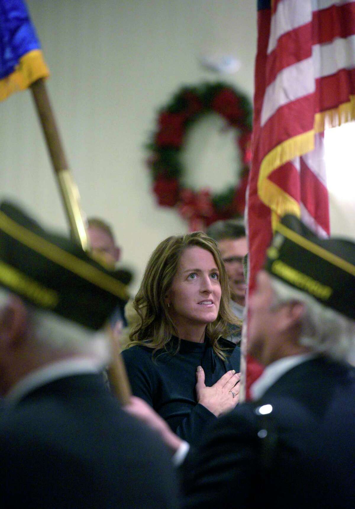 Tara Carr say the Pledge of Allegiance during the Town of Brookfield, inauguration and swearing-in ceremony, Friday night at St Marguerite Bourgeoys church, Brookfield, Conn, December 3, 2021. Carr was elected First Selectman.