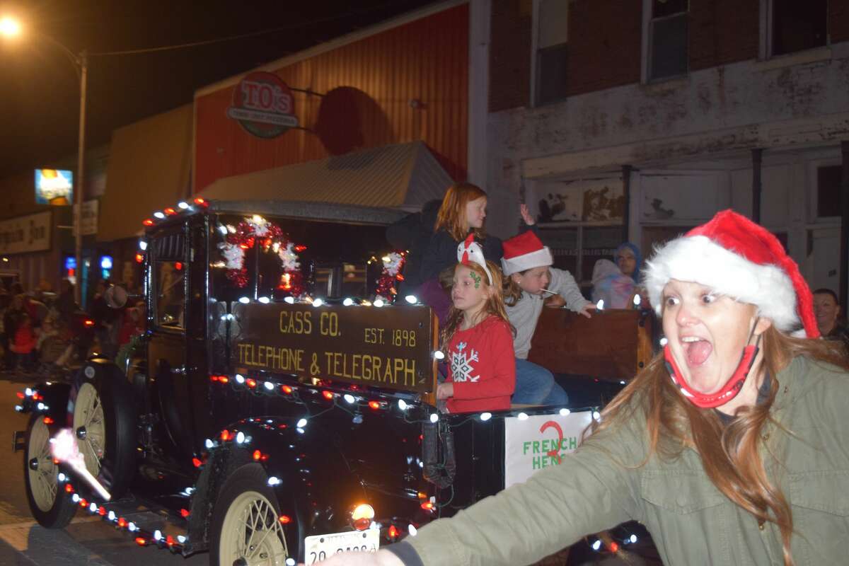 Participants share some holiday spirit during the 2021 Christmas in Virginia parade.