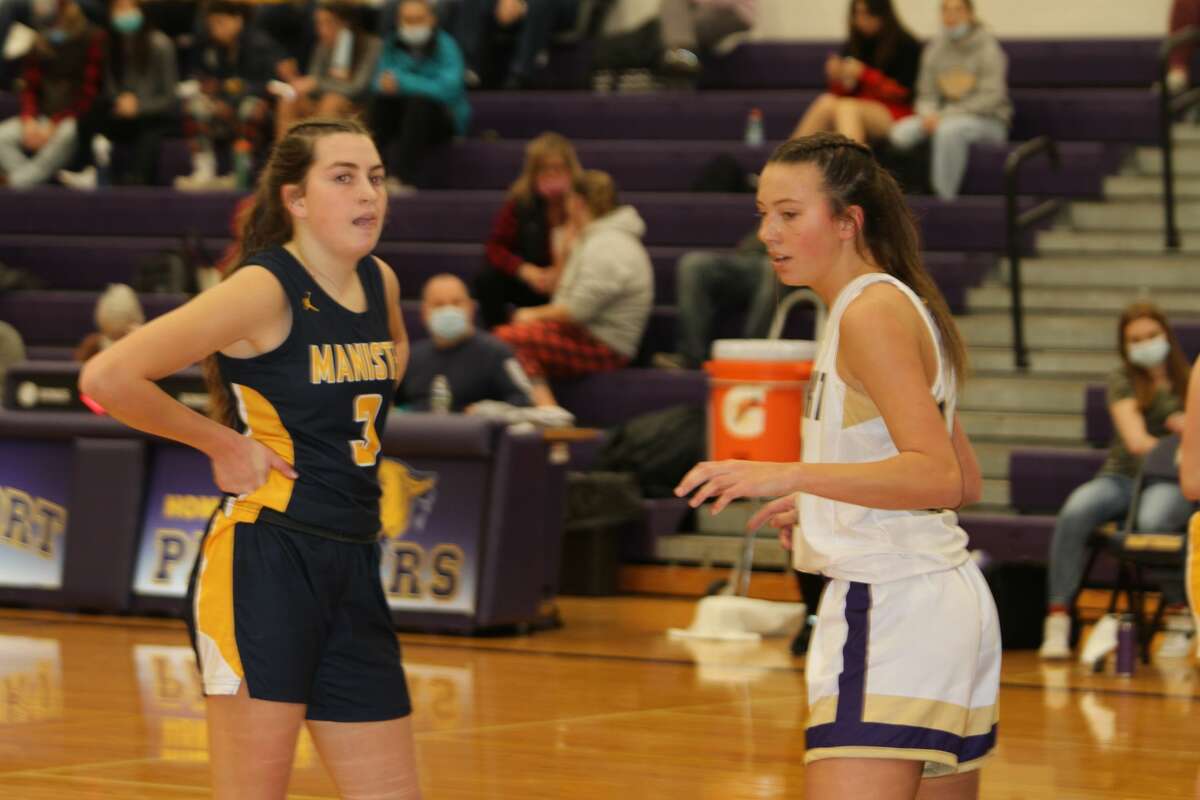 Manistee's Libby McCarthy guards Frankfort's Grace Wolfe on the inbounds play. 