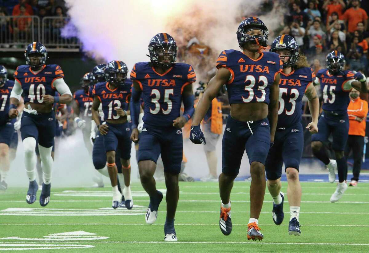 The UTSA Roadrunners take the field for the game against Western Kentucky during the 2021 Conference USA Championship football game at the Alamodome on Friday, Dec. 3, 2021.