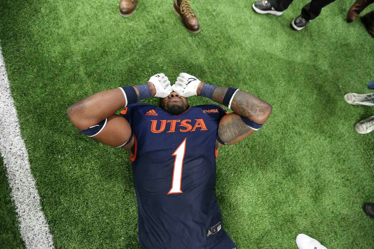 UTSA's Leroy Watson (01) appears overcome with emotion after UTSA defeats Western Kentucky in the 2021 Conference USA Championship football game at the Alamodome on Friday, Dec. 3, 2021. The Roadrunners defeated the Hilltoppers, 49-41, to win the championship.