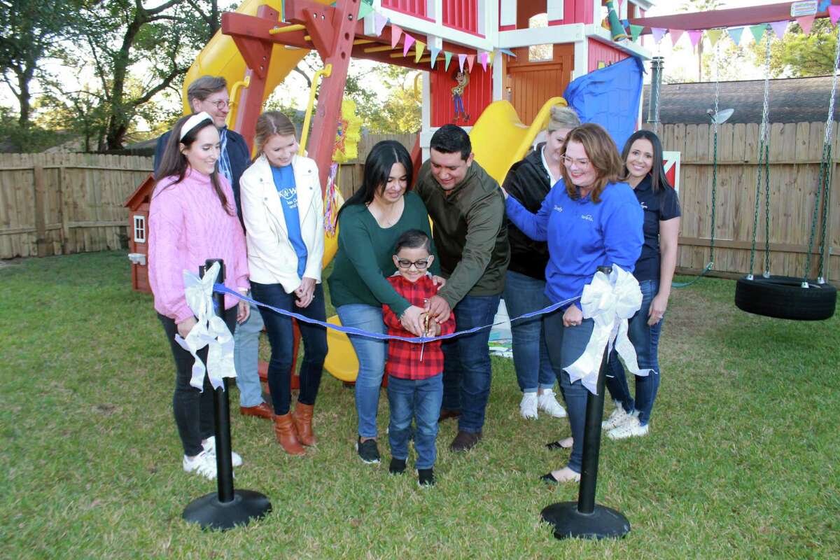 Aryan Rodriguez and his parents celebrate a new Toy Story-inspired playhouse. The playhouse was given to him by Make-A-Wish and Gensler.