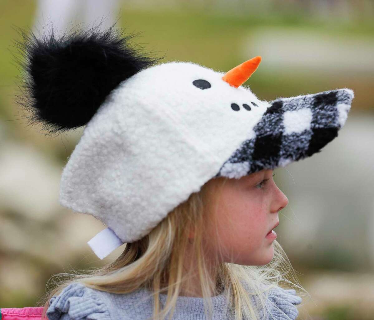 Addison Larsen wears a snowman-themed hat during Willis’ annual Christmas parade, Saturday, Dec. 4, 2021, in Willis.