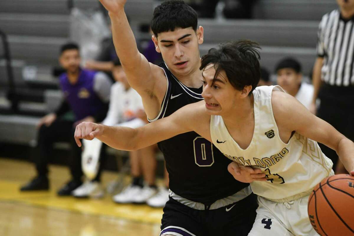 LBJ’s Roger Leyendecker challenges Alexander’s Nick Ordonez along the baseline during the Wolfpack’s 64-62 win over the Bulldogs on Friday.