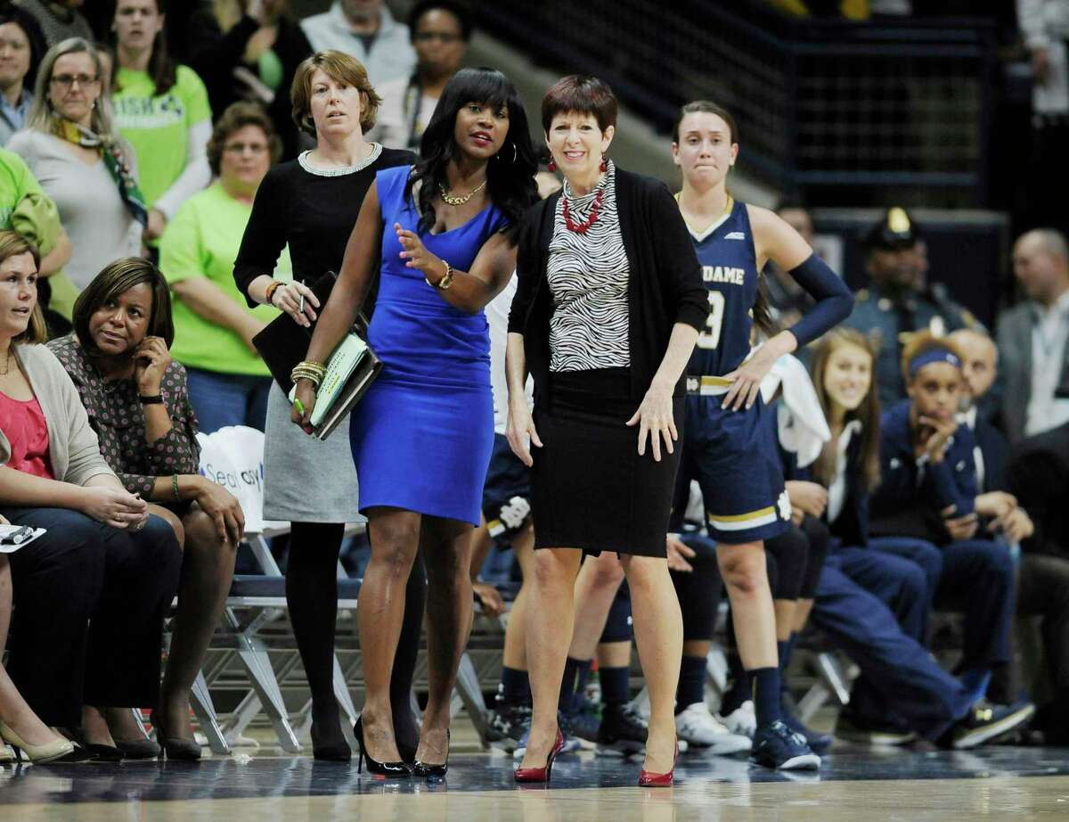 Notre Dame associate coach Niele Ivey, left, and head coach Muffet McGraw watch during the first half against UConn in Storrs in 2015.