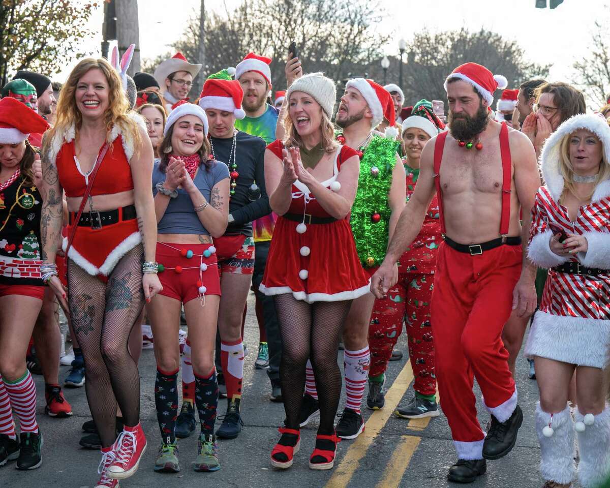 Runners participate in the 16th annual Santa Speedo Sprint hosted by the Albany Society for the Advancement of philanthropy to benefit the Albany Damien Center and the HIV/AIDS program at Albany Medical Center Hospital on Lark Street in Albany, New York, on Saturday, Dec. 4, 2021 (Jim Franco/Special to the Times Union)