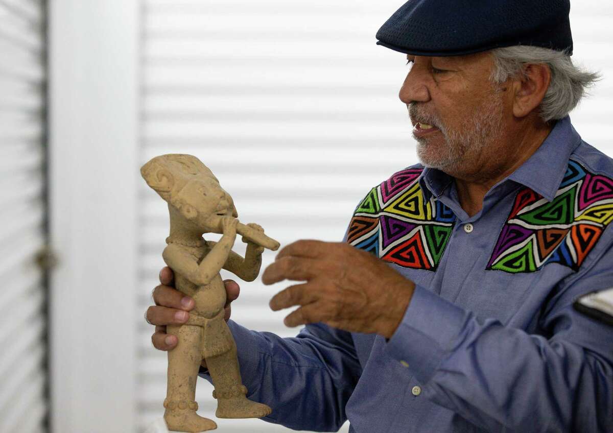Jesus Cantu Medel talks about an Indigenous artifact, which is part of the Museo Guadalupe Aztlan, on Tuesday, Nov. 9, 2021, in Houston.