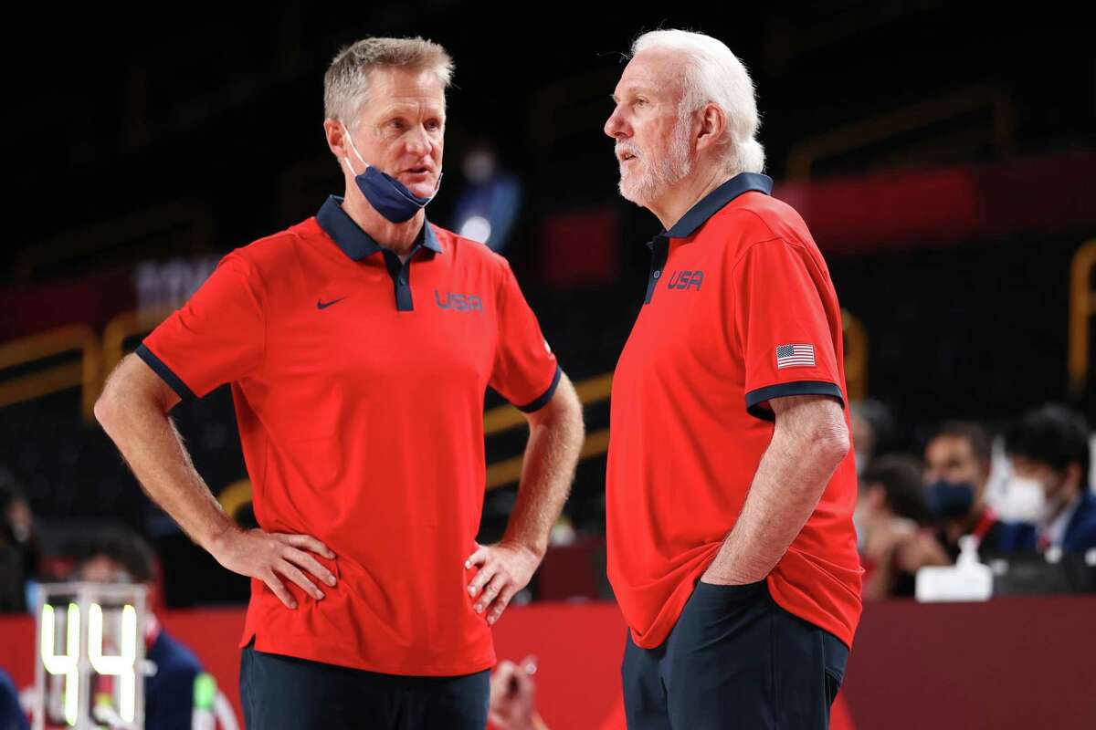 SAITAMA, JAPAN - JULY 31: Team United States Head Coach Gregg Popovich (right) speaks with Assistant Coach Steve Kerr during the second half of a Men's Basketball Preliminary Round Group A game on day eight of the Tokyo 2020 Olympic Games at Saitama Super Arena on July 31, 2021 in Saitama, Japan. (Photo by Gregory Shamus/Getty Images)