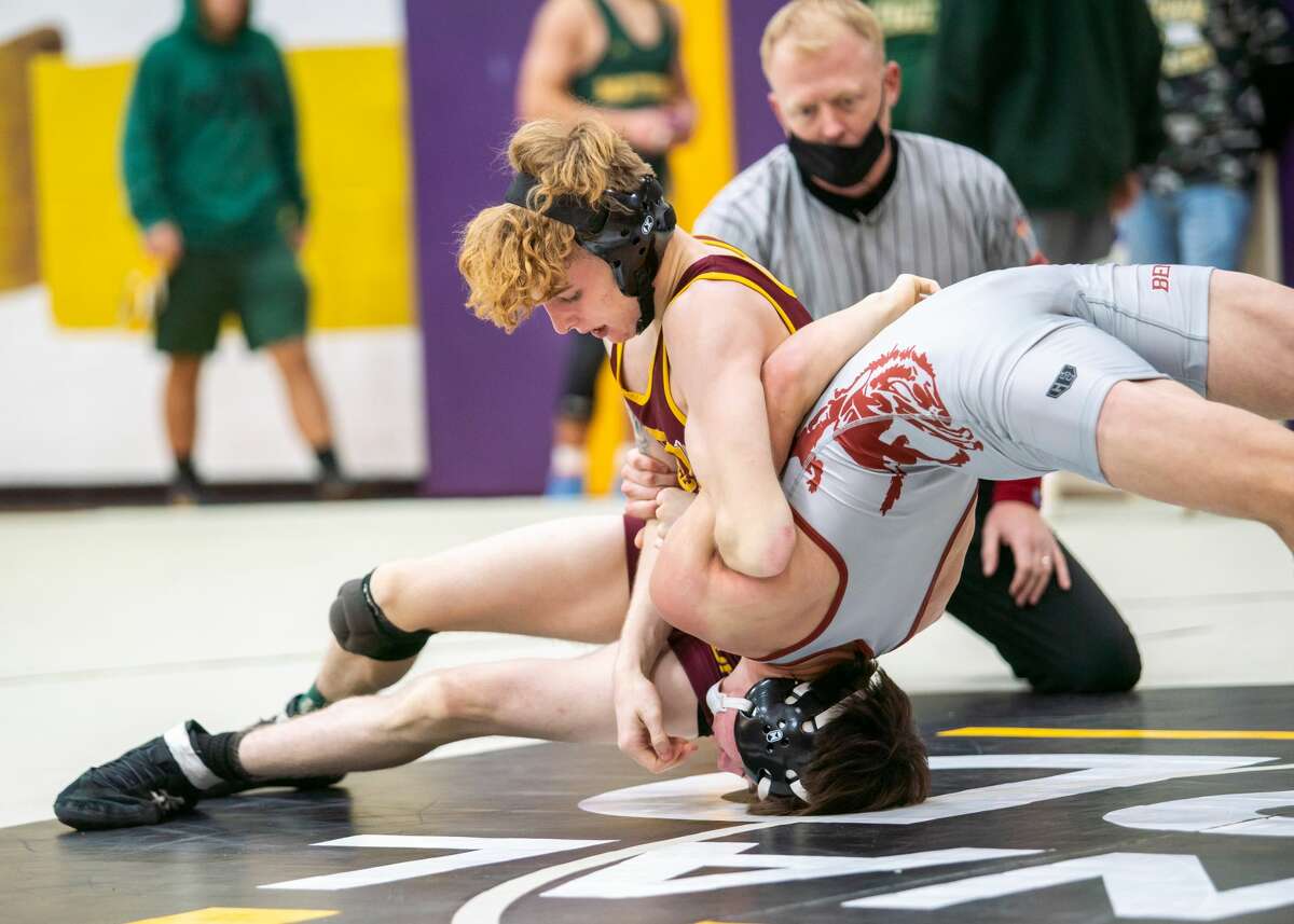 Jason Shaw of East Alton-Wood River, top, works against Benton's Mason Tieffel in the 126-pound championship bout Saturday at the CM Wrestling Tourney. Shaw won the title.