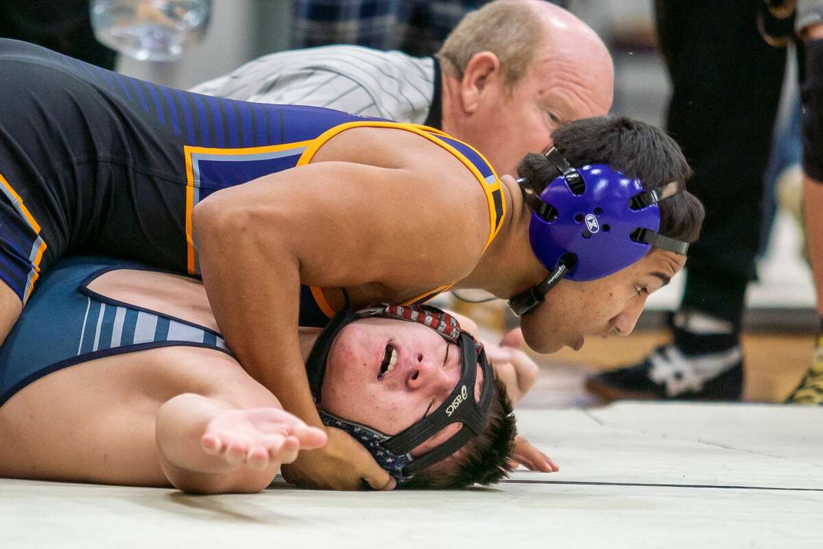 Civic Memorial's Miguel Gonzalez, top, pins Jersey's Connor Chin in the 182-pound championship bout Saturday at the 42nd Civic Memorial Wrestling Tournament in Bethalto.