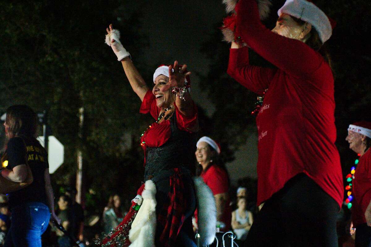 Members of the Hometown Heroes Zumba class perform during the League City Holiday in the Park Grand Night Parade Saturday, Dec. 4, 2021.