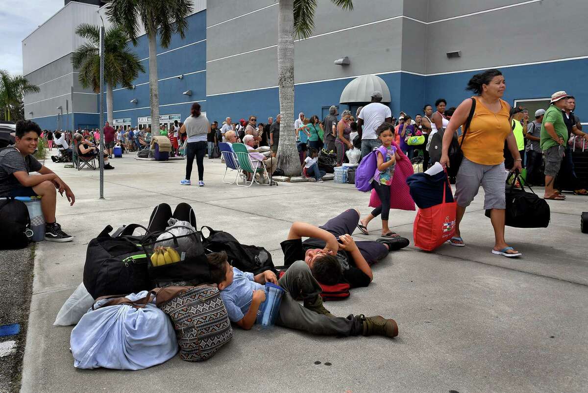 Tired families wait outside the Germain Arena for a shelter spot in Florida on Sept. 9, 2017. The arena became a shelter for those who had fled Hurricane Irma.