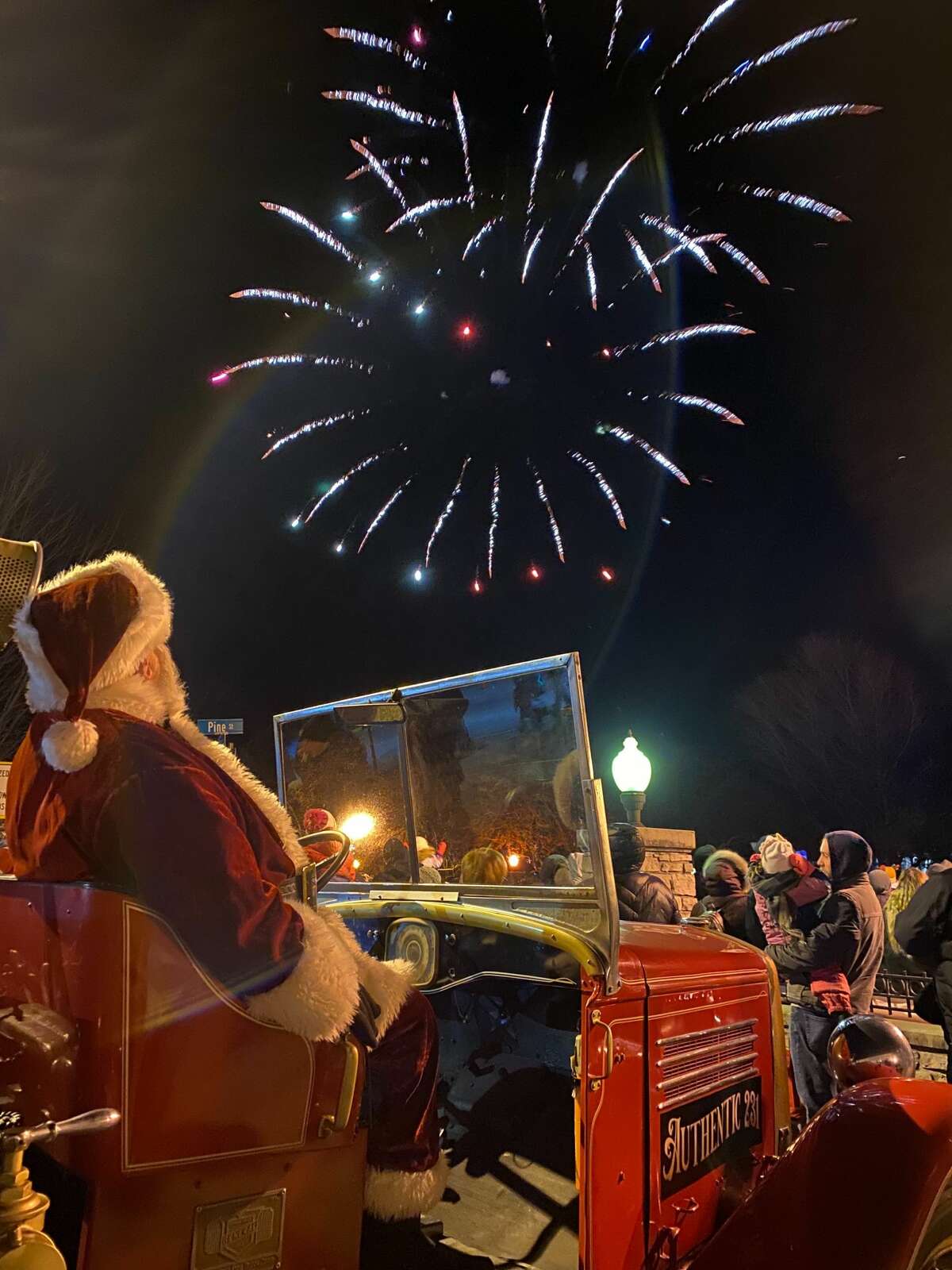 Santa Claus and attendees watch fireworks at the close of this year's Victorian Sleighbell Parade. 