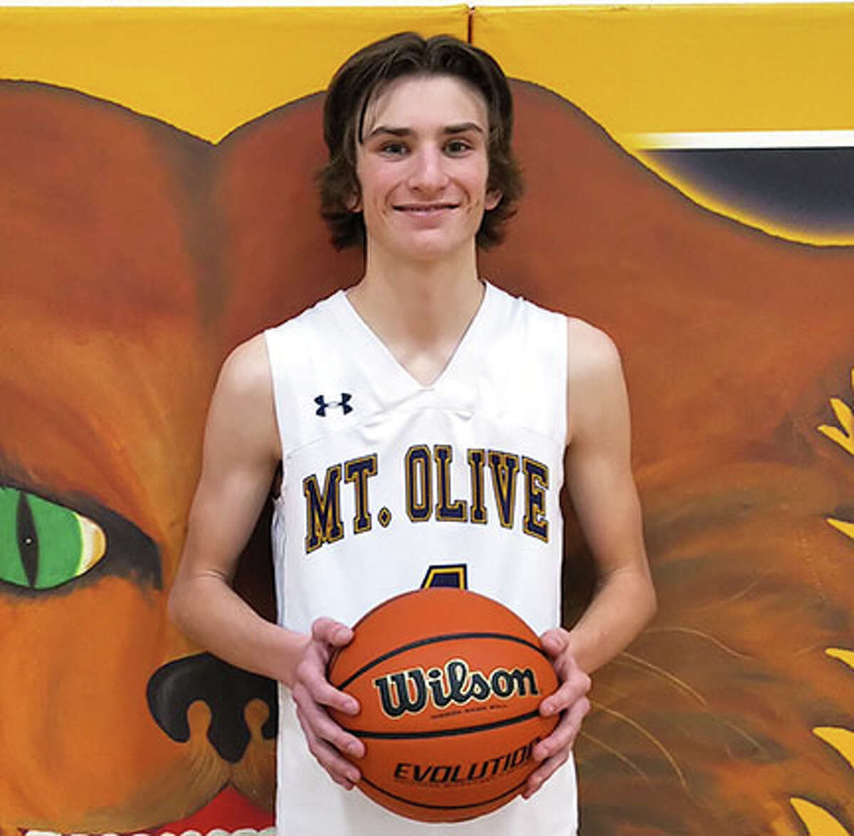 Mount Olive's Trent Markezich scored his 1,000th career point for the Wildcats on Friday night.