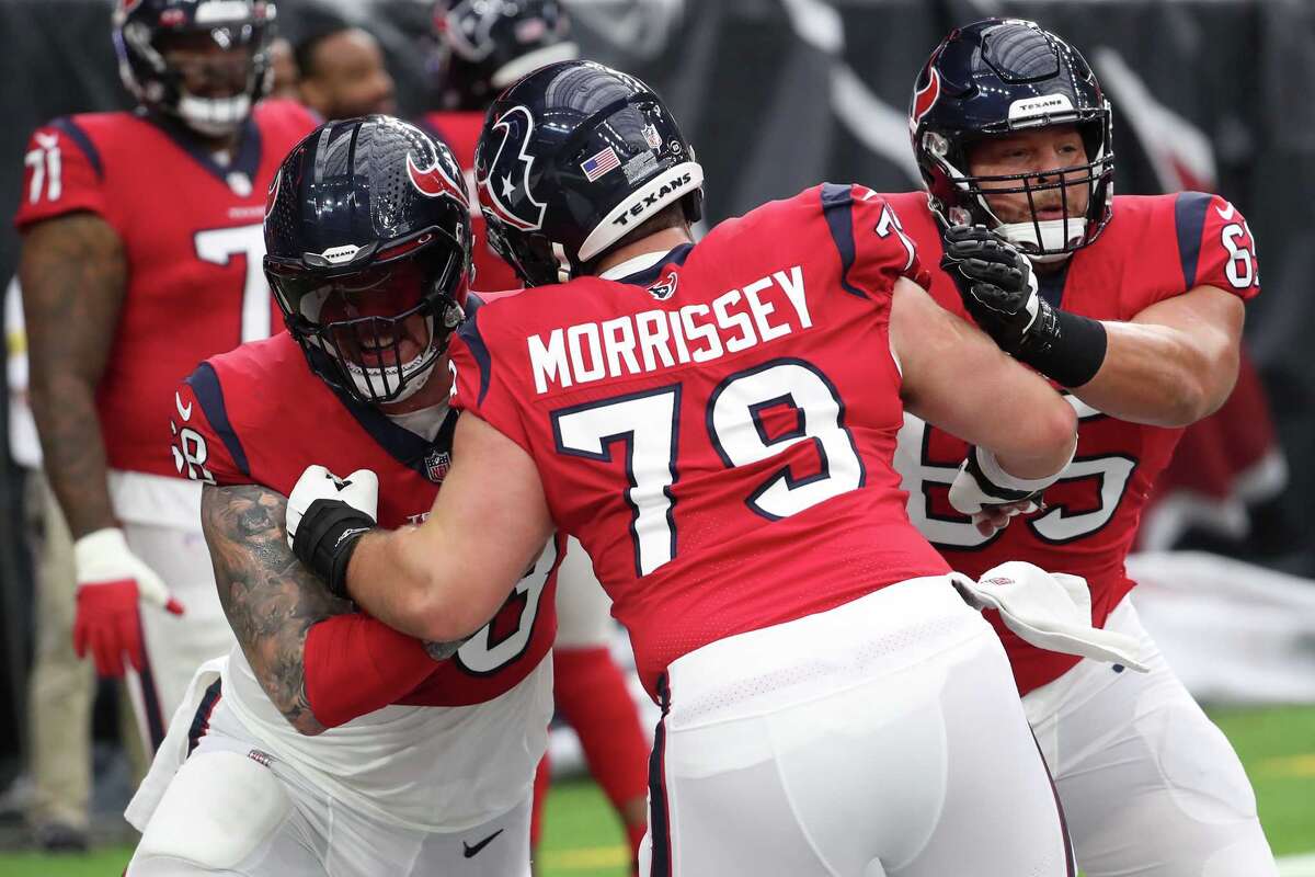 Houston Texans center Justin Britt (68), center Jimmy Morrissey (79) and guard Lane Taylor (65) warm up before an NFL football game against the Indianapolis Colts Sunday, Dec. 5, 2021 in Houston.