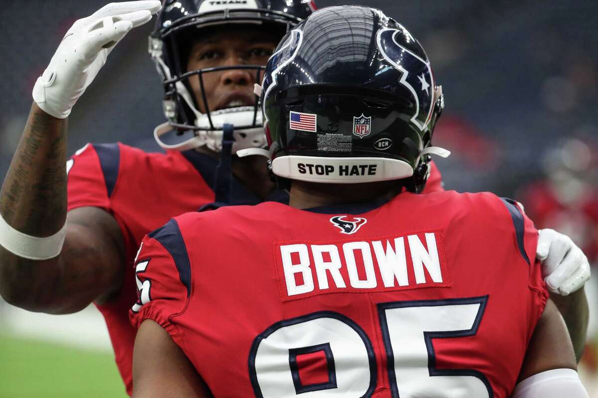 Houston Texans tight end Pharaoh Brown wears a Stop Hate logo on his helmet before an NFL football game against the Indianapolis Colts Sunday, Dec. 5, 2021 in Houston.
