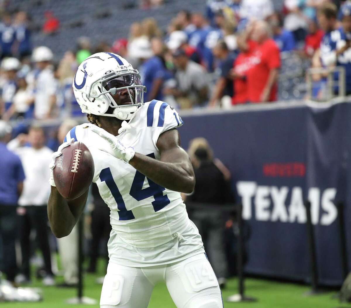 Indianapolis Colts wide receiver Zach Pascal (14) plays catch with fans during warmups before an NFL football game at NRG Stadium, Sunday, Dec. 5, 2021 in Houston.