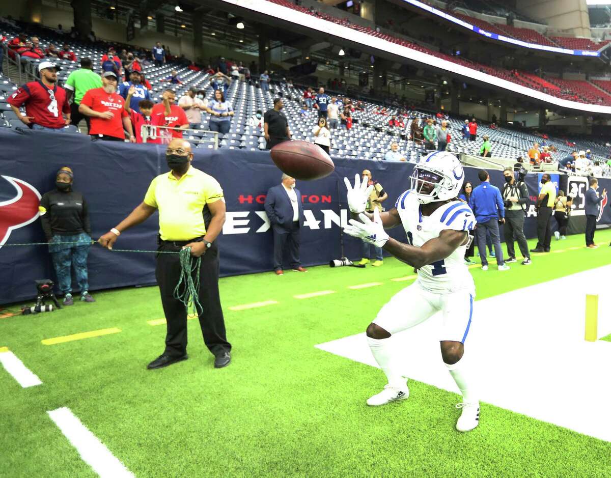 Indianapolis Colts wide receiver Zach Pascal (14) plays catch with fans during warmups before an NFL football game at NRG Stadium, Sunday, Dec. 5, 2021 in Houston.