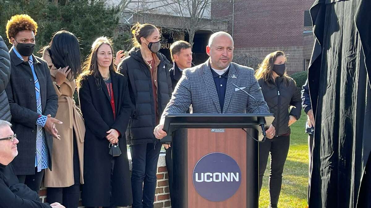 Former UConn athletes gather outside Gampel Pavilion on Sunday, Dec. 5, 2021 as the school unveiled a momument honoring Olympians with UConn ties.
