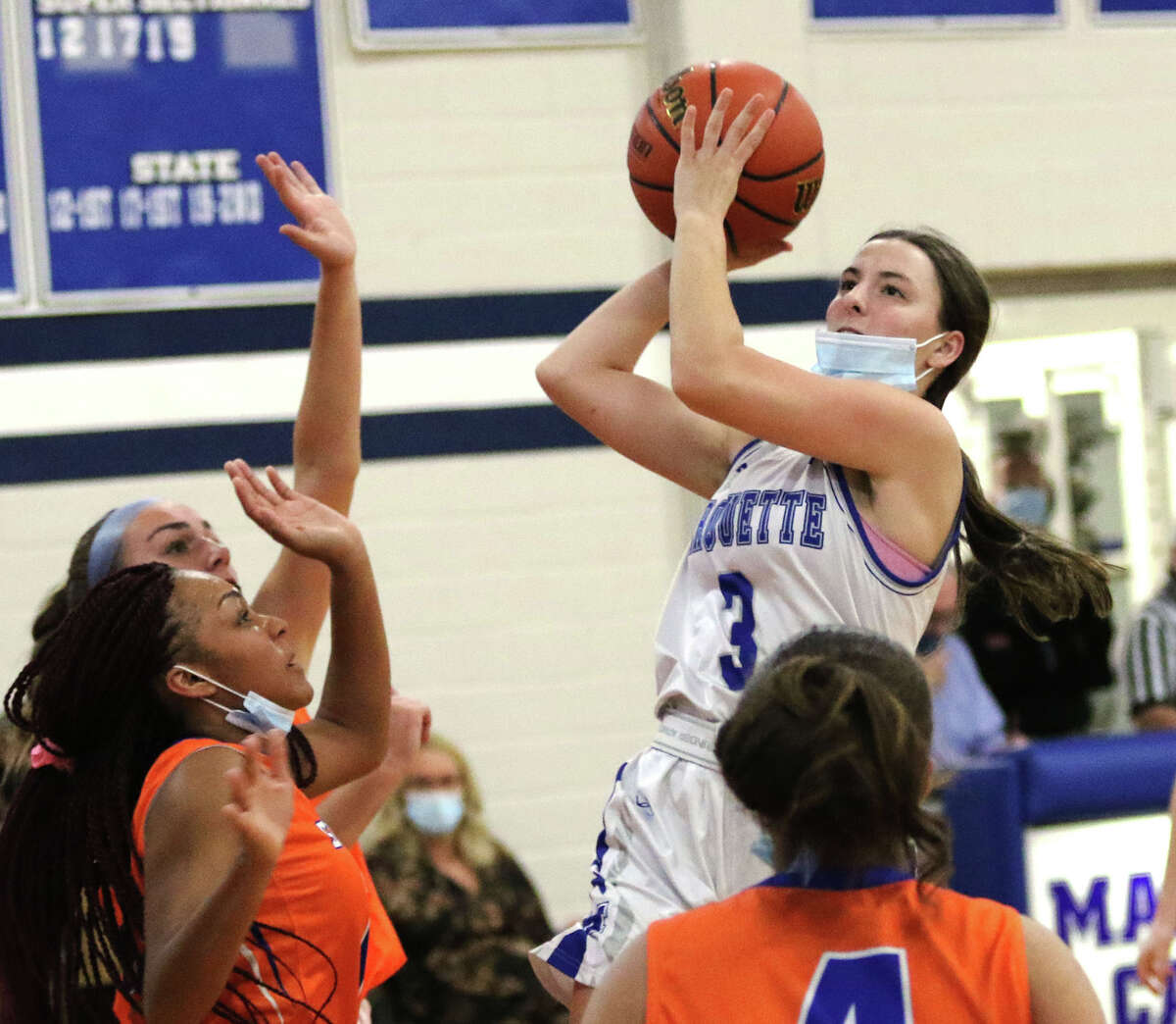 Marquette's Kamryn Fandrey (3) puts up a shot in the lane against Decatur St. Teresa on Saturday afternoon in Alton.