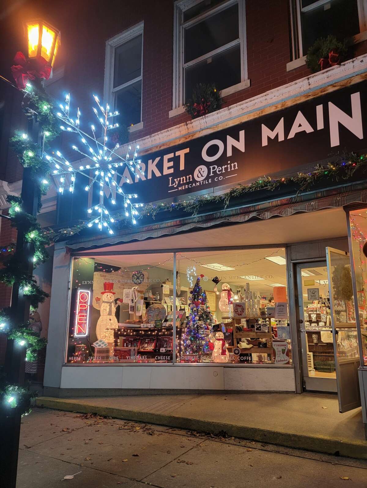 Light poles and store fronts are decorated for Christmas in downtown Frankfort as part of an effort to try and reinvigorate the city for the season 