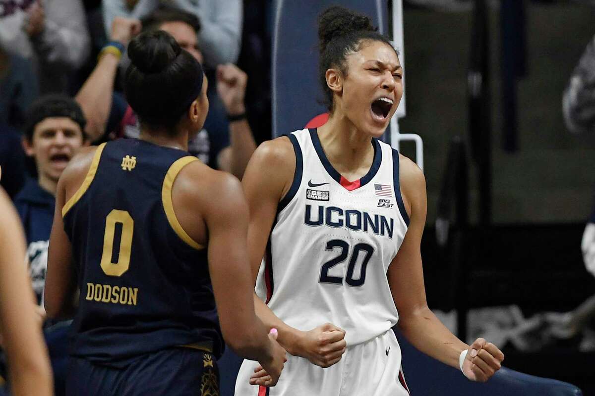 Connecticut's Olivia Nelson-Ododa (20) reacts after making a basket while fouled in the first half of an NCAA college basketball game against Notre Dame, Sunday, Dec. 5, 2021, in Storrs, Conn. (AP Photo/Jessica Hill)