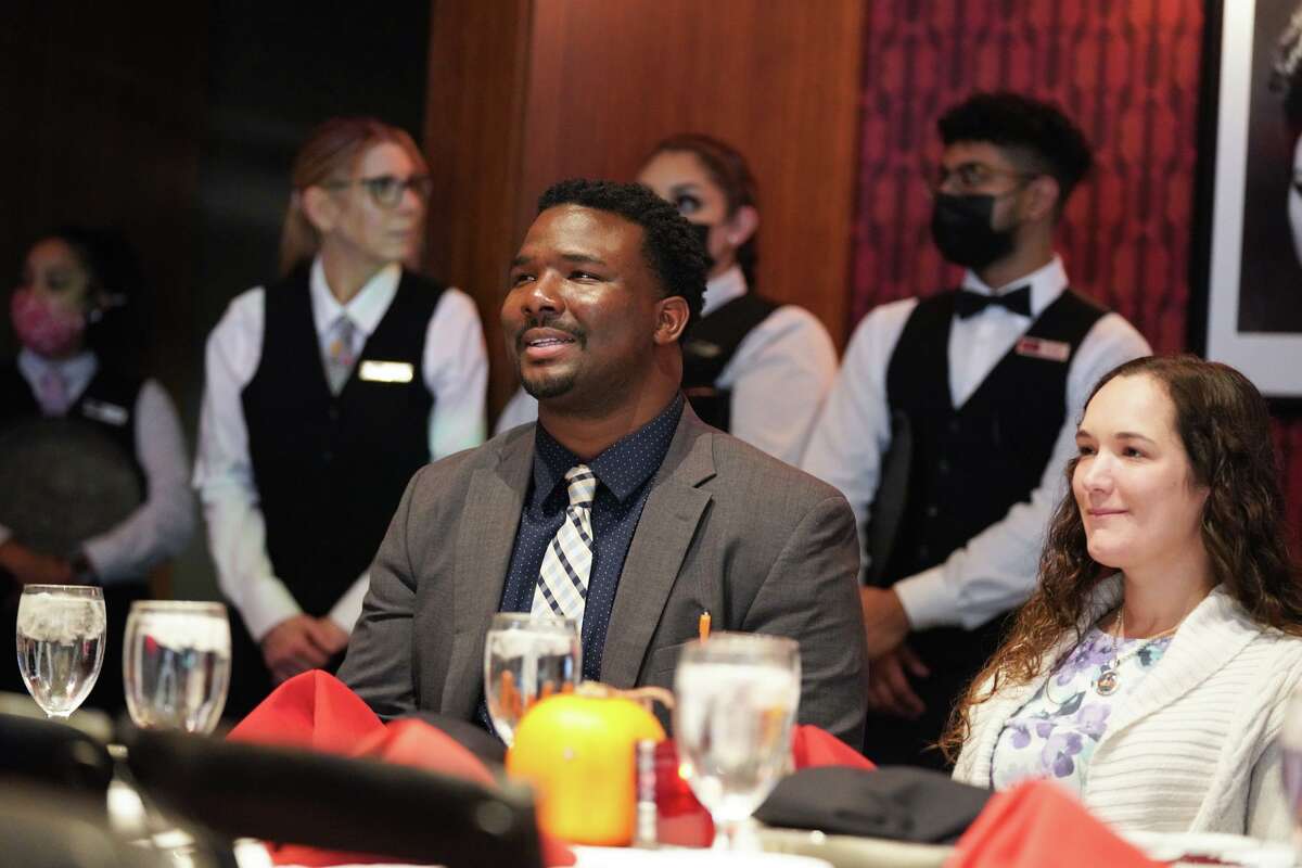 Earnest Jones smiles during the Roy Maas Youth Alternatives Thanksgiving luncheon at Ruth’s Chris Steak House on Sunday, Nov. 21. Jones was rescued from a rooftop during Hurricane Katrina and later deserted by his parents but is now a Roy Maas board member.