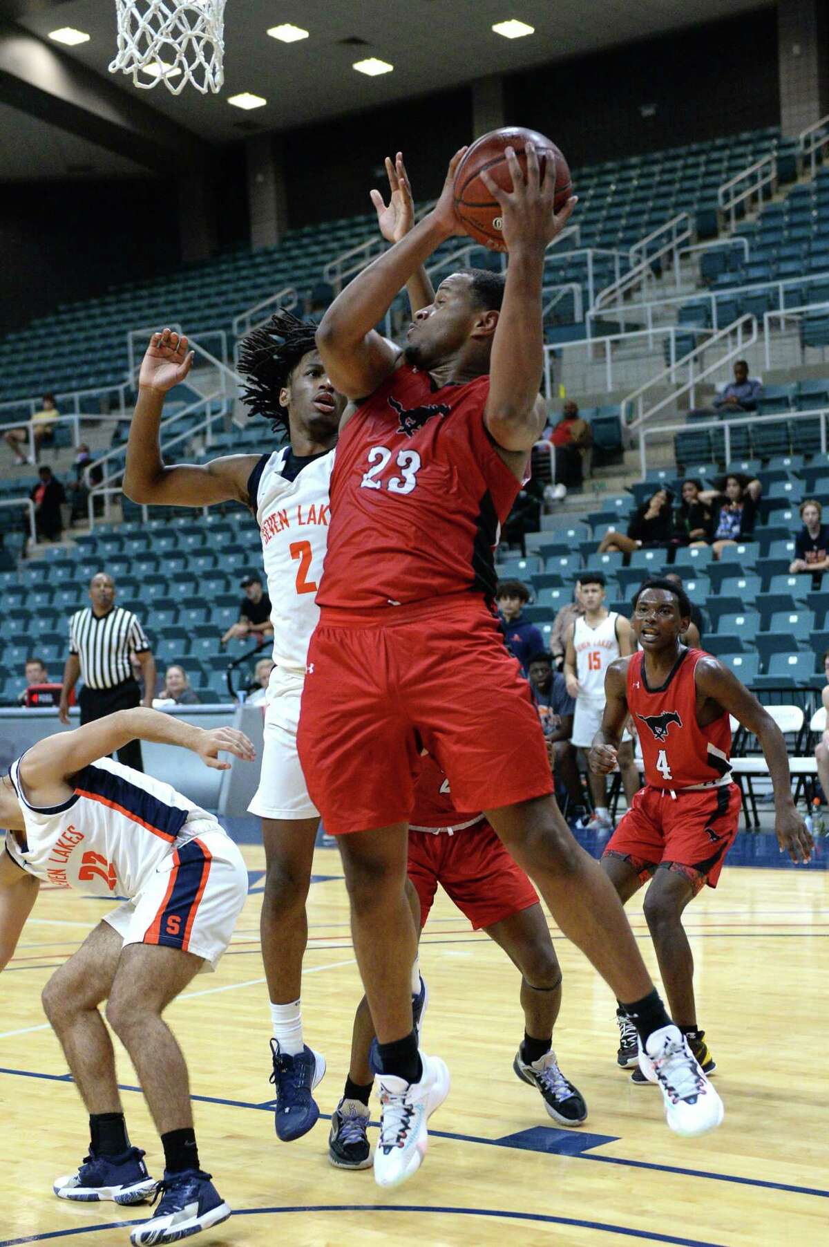 Willie Williams (23) of Westfield grabs a rebound during the second half of the Gold Bracket championship game between the Seven Lakes Spartans and the Westfield Mustangs in the Katy ISD Basketball Classic on Saturday, December 5, 2021 at the Leonard Merrill Center, Katy, TX.