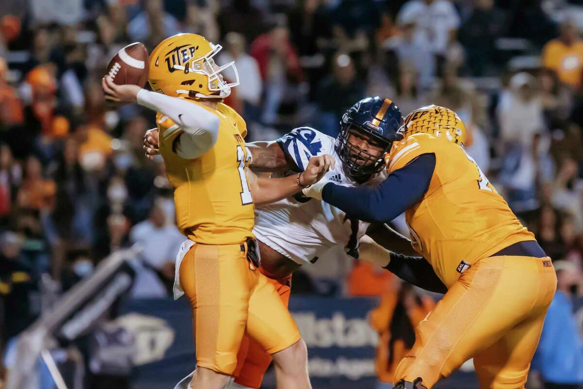 UTEP quarterback Gavin Hardison (12) throws a pass during an NCAA college football game against UTSA in El Paso, Texas, Saturday, Nov. 6, 2021. (Gaby Velasquez/The El Paso Times via AP)