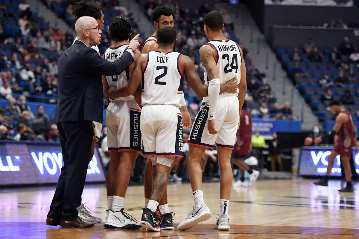Connecticut head coach Dan Hurley talks to his team in the second half of an NCAA college basketball game, Tuesday, Nov. 30, 2021, in Hartford, Conn. (AP Photo/Jessica Hill)